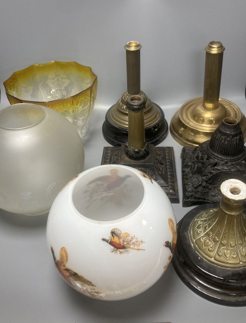 A group of late 19th/early 20th century oil lamp shades and base parts (4)